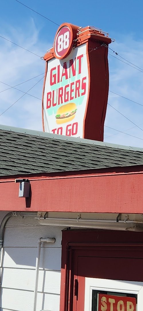 Fresh burgers served beside golden fries.