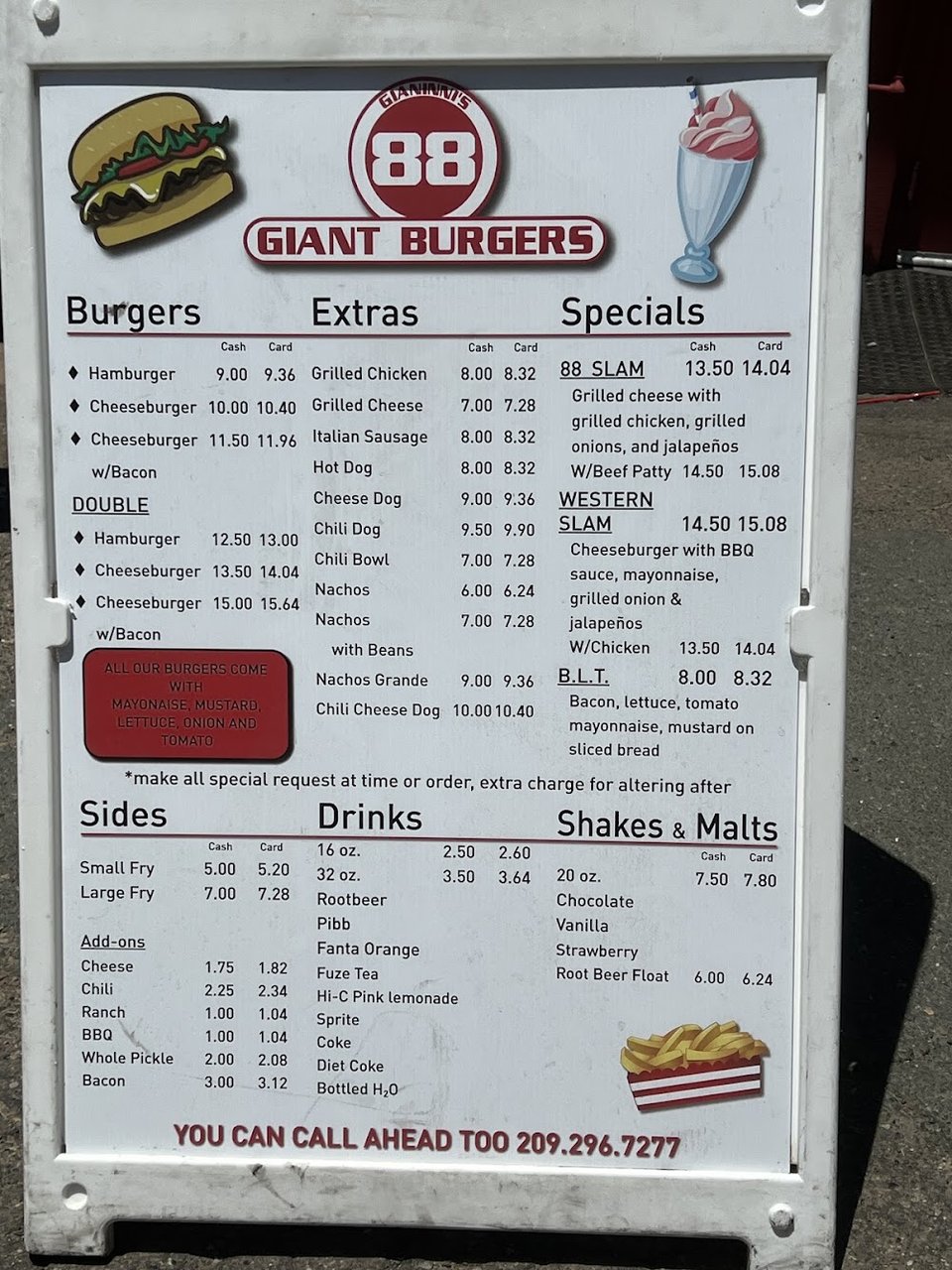 Menu board with burgers, fries, and shakes.