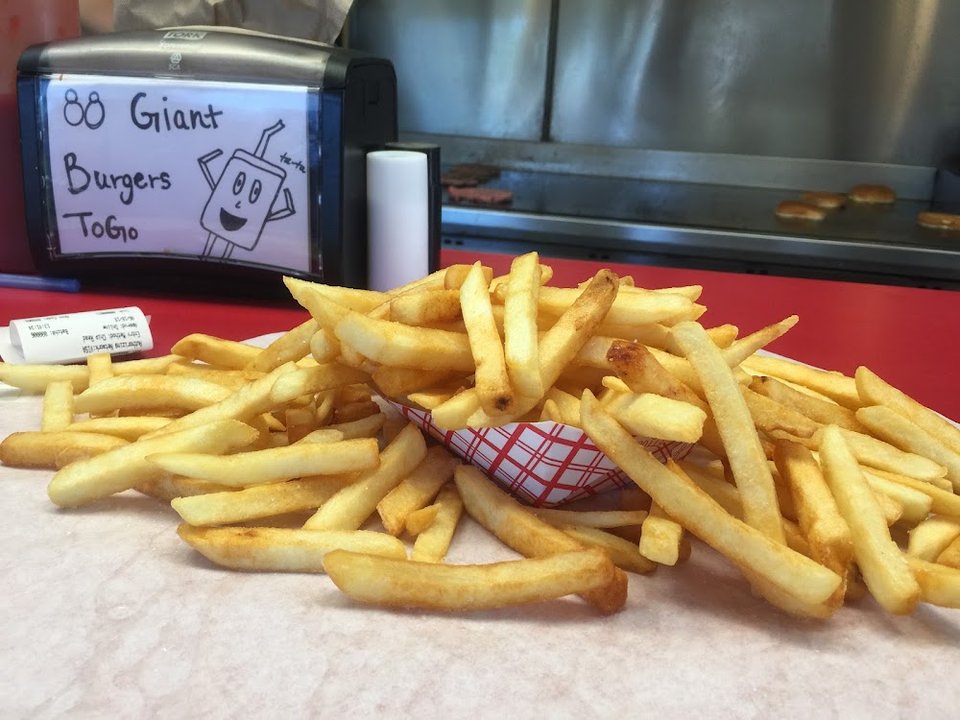 Burger menu with extras, drinks, and fries.