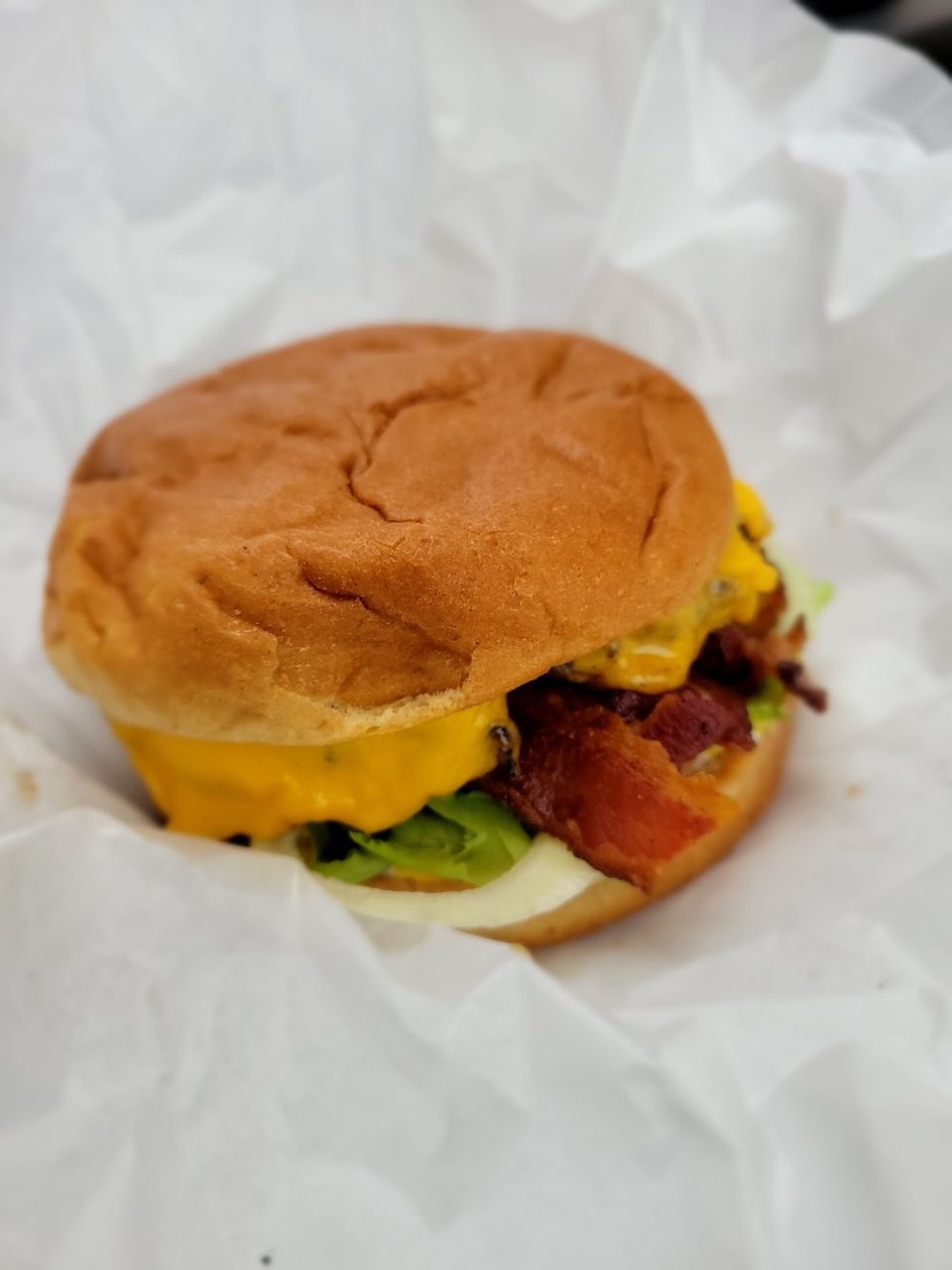 Printed menu listing cheeseburgers and milkshakes.